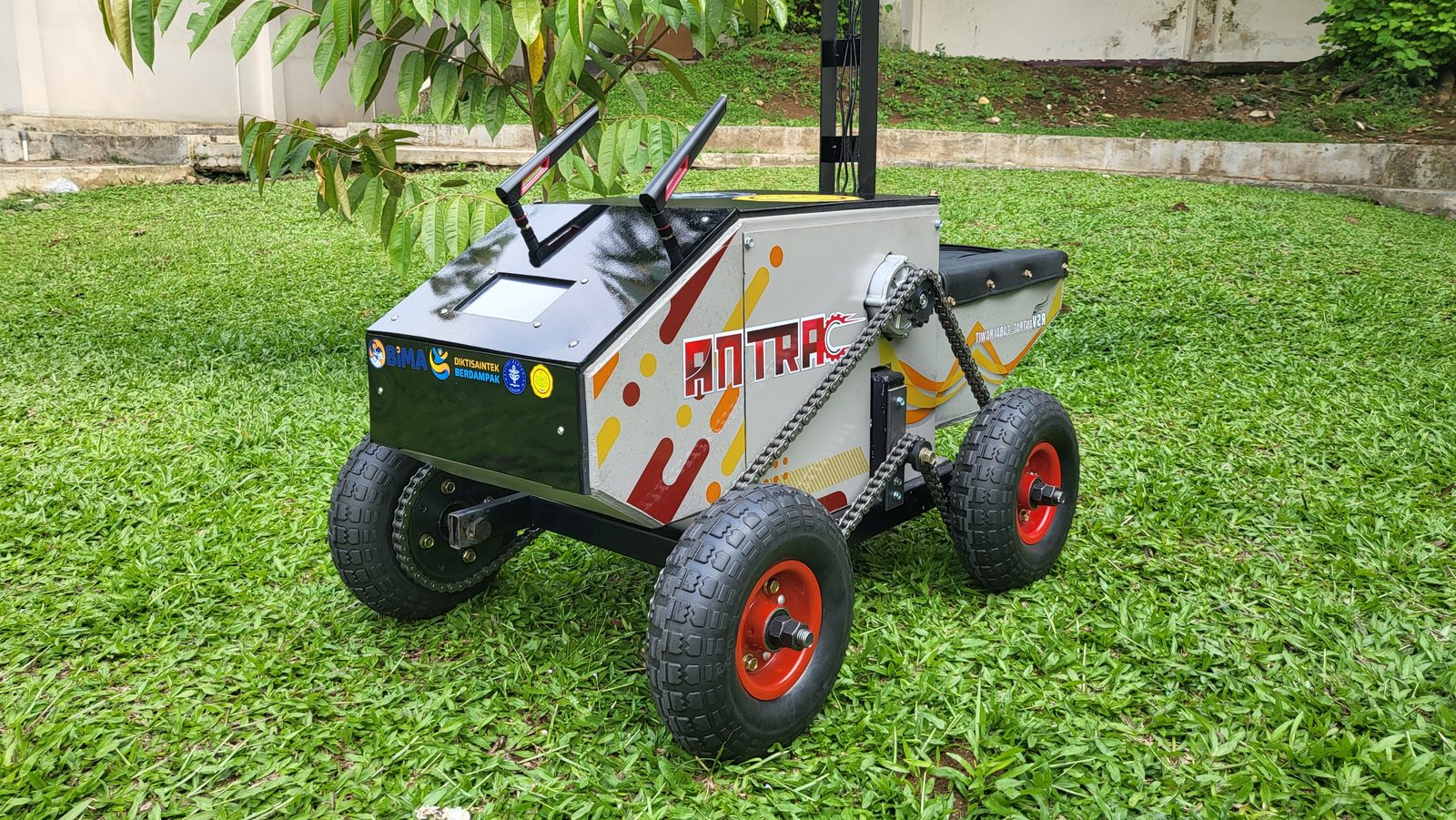 ANTRAC on grass during a field test, mast and wheels fully in frame.