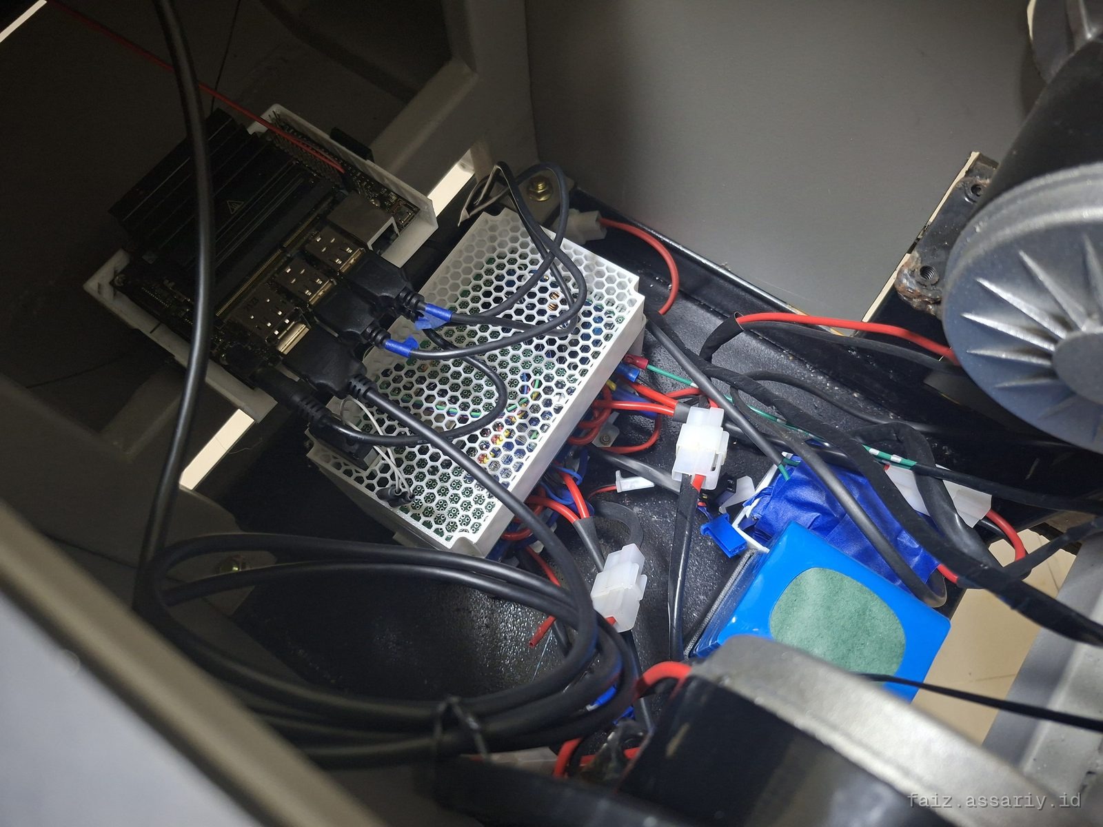 Inside the control and power bay: motor driver, battery pack, heatsink and wiring loom.